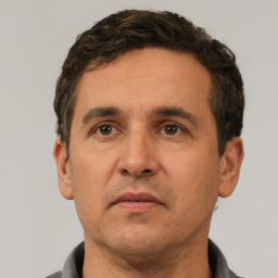 Neutral white adult male with short  black hair and brown eyes