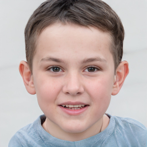 Joyful white child male with short  brown hair and grey eyes