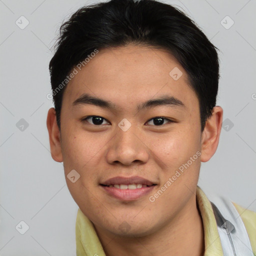 Joyful asian young-adult male with short  brown hair and brown eyes