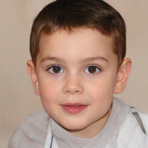 Joyful white child male with short  brown hair and brown eyes