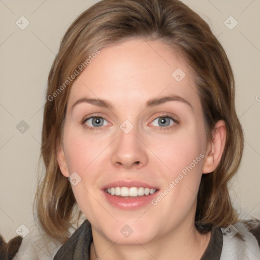 Joyful white young-adult female with medium  brown hair and blue eyes