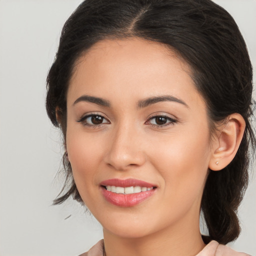 Joyful white young-adult female with medium  brown hair and brown eyes