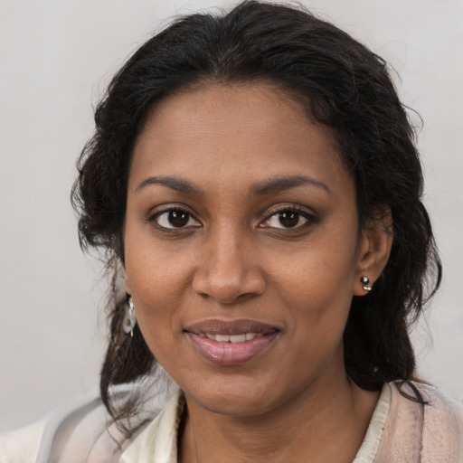 Joyful black young-adult female with medium  brown hair and brown eyes