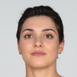 Neutral white young-adult female with short  brown hair and brown eyes