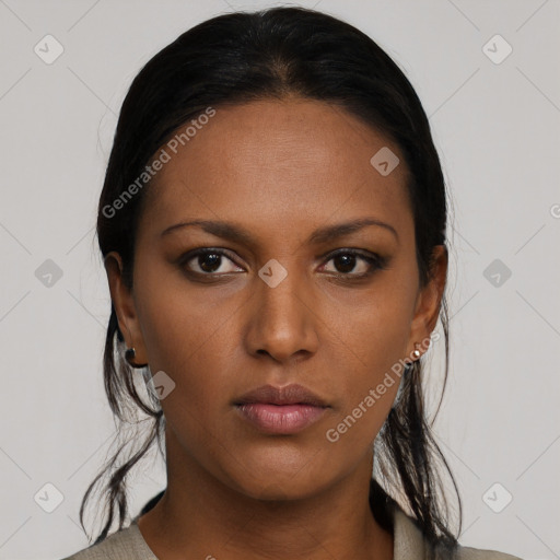 Neutral black young-adult female with medium  brown hair and brown eyes