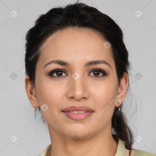 Joyful latino young-adult female with medium  brown hair and brown eyes
