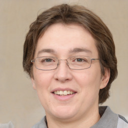 Joyful white adult female with medium  brown hair and grey eyes