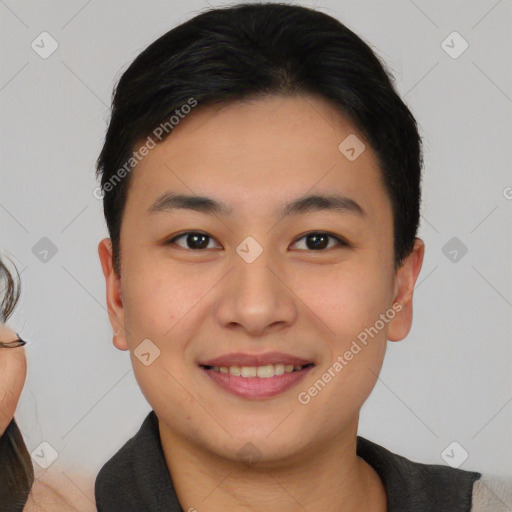 Joyful white young-adult male with short  black hair and brown eyes