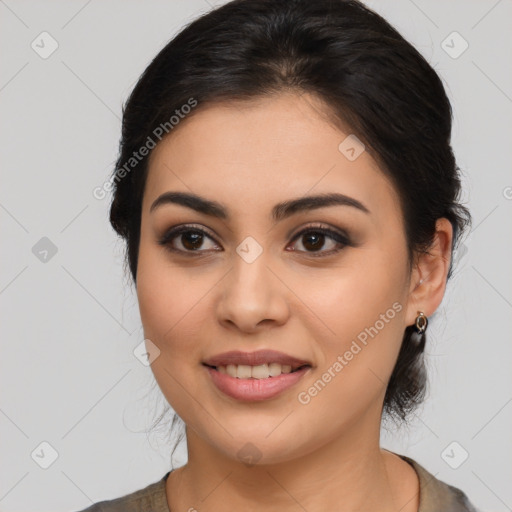 Joyful latino young-adult female with medium  brown hair and brown eyes