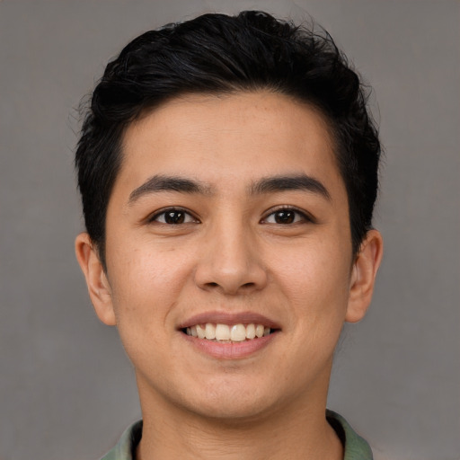 Joyful white young-adult male with short  black hair and brown eyes