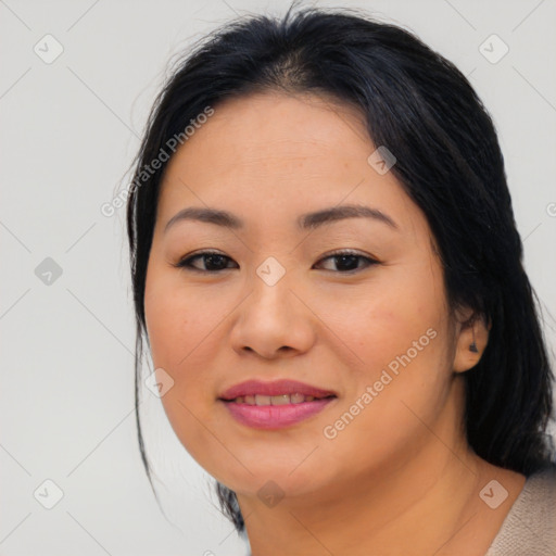 Joyful asian young-adult female with medium  brown hair and brown eyes