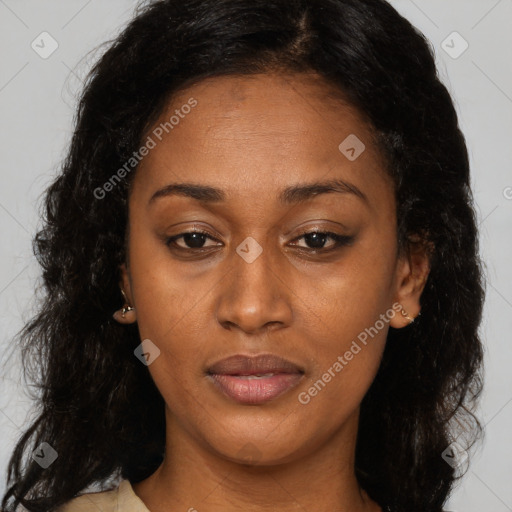 Joyful black adult female with long  brown hair and brown eyes