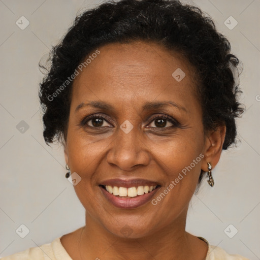 Joyful black adult female with short  brown hair and brown eyes