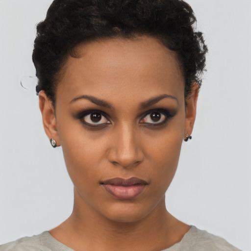 Neutral black young-adult female with short  brown hair and brown eyes