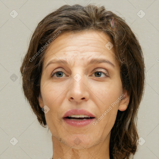 Joyful white adult female with short  brown hair and brown eyes