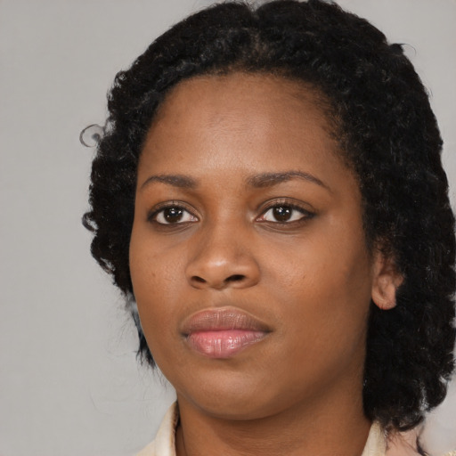 Neutral black young-adult female with medium  black hair and brown eyes