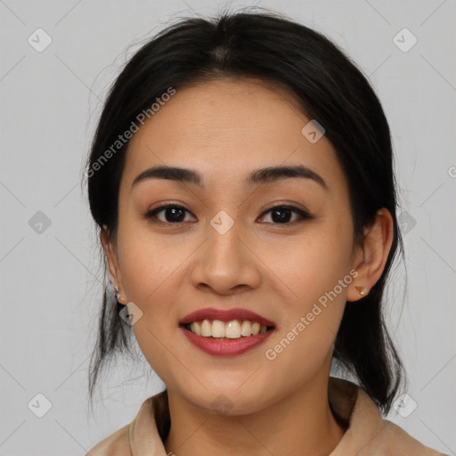 Joyful latino young-adult female with medium  brown hair and brown eyes