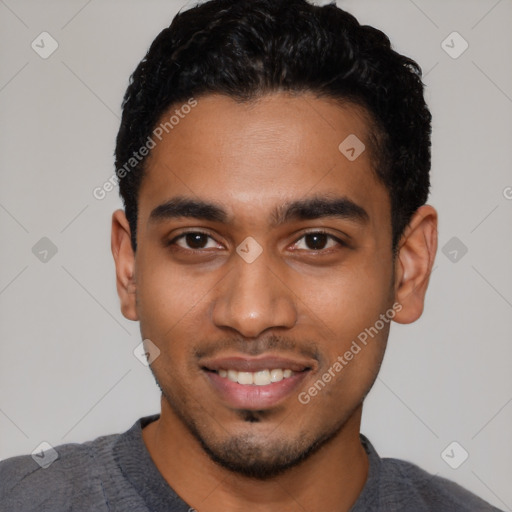 Joyful black young-adult male with short  black hair and brown eyes