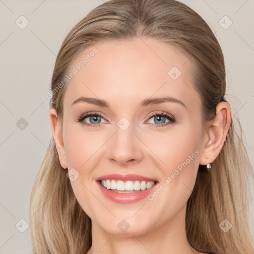 Joyful white young-adult female with long  brown hair and blue eyes