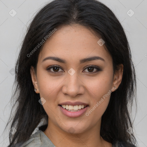 Joyful latino young-adult female with long  brown hair and brown eyes