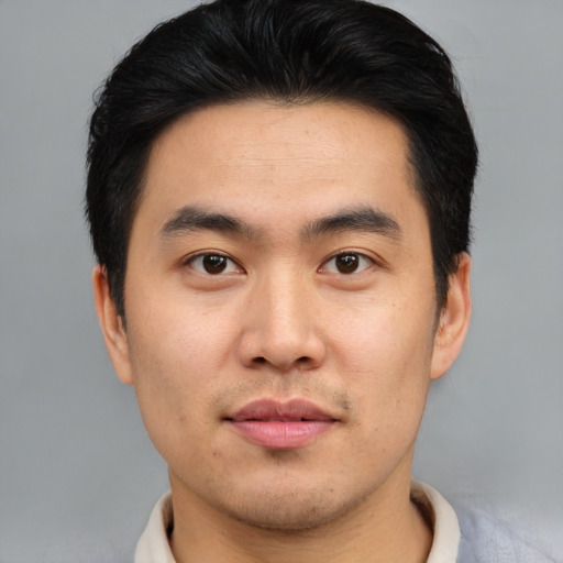 Neutral asian young-adult male with short  black hair and brown eyes