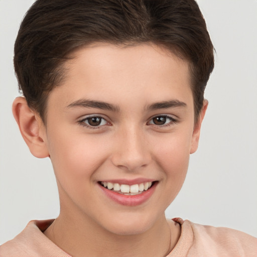 Joyful white child female with short  brown hair and brown eyes