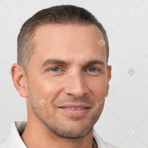 Joyful white adult male with short  brown hair and brown eyes