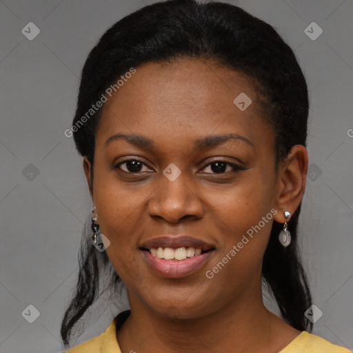 Joyful latino young-adult female with short  black hair and brown eyes