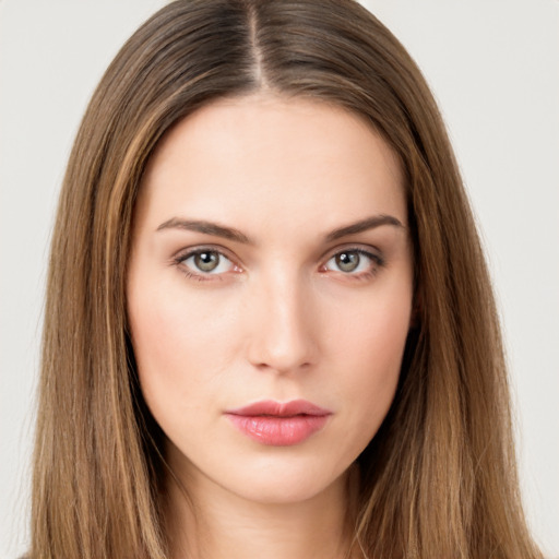 Neutral white young-adult female with long  brown hair and brown eyes