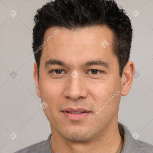 Joyful white adult male with short  black hair and brown eyes