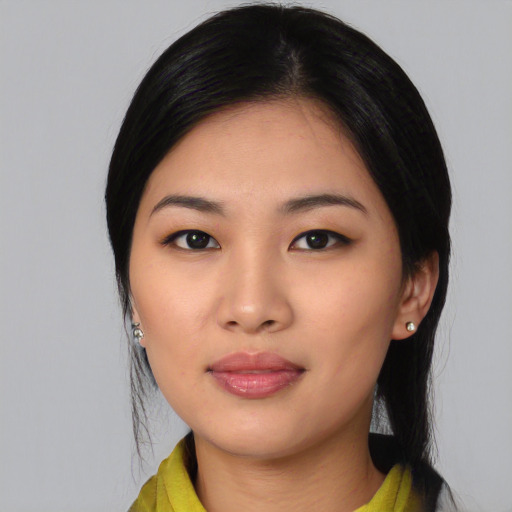 Joyful asian young-adult female with medium  black hair and brown eyes