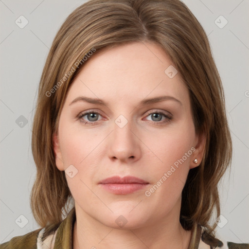 Joyful white young-adult female with medium  brown hair and green eyes