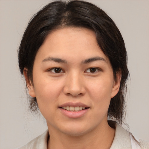 Joyful white young-adult female with medium  brown hair and brown eyes