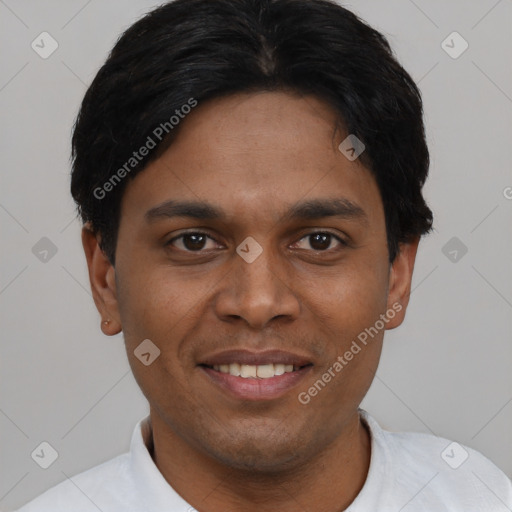 Joyful black young-adult male with short  brown hair and brown eyes