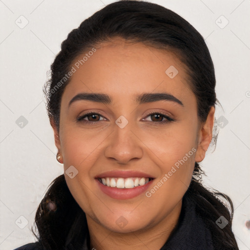 Joyful white young-adult female with long  black hair and brown eyes