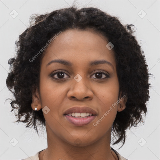 Joyful black young-adult female with long  brown hair and brown eyes