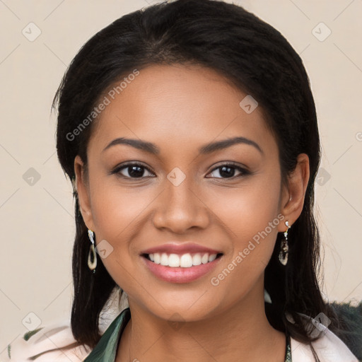 Joyful latino young-adult female with long  black hair and brown eyes