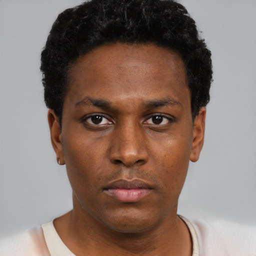 Neutral black young-adult male with short  black hair and brown eyes