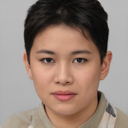 Joyful asian young-adult female with short  brown hair and brown eyes