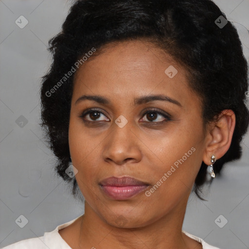 Joyful black adult female with short  brown hair and brown eyes