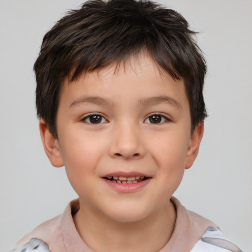 Joyful white child male with short  brown hair and brown eyes