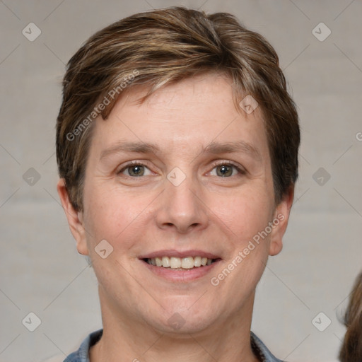 Joyful white adult male with short  brown hair and grey eyes