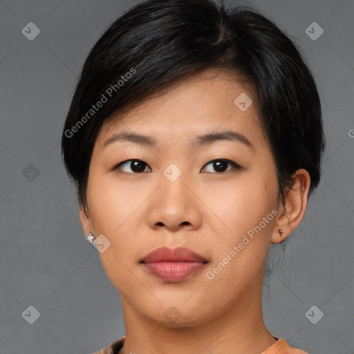 Joyful asian young-adult female with medium  black hair and brown eyes