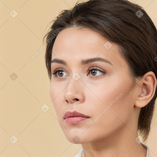 Neutral white young-adult female with medium  brown hair and brown eyes