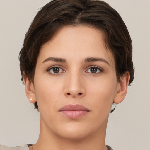 Neutral white young-adult female with short  brown hair and brown eyes