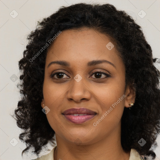 Joyful black young-adult female with medium  brown hair and brown eyes