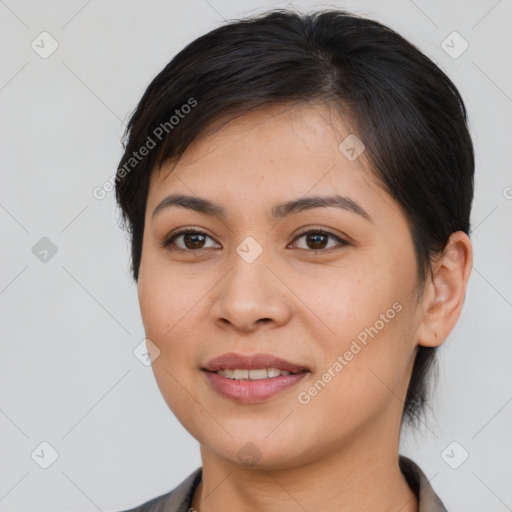 Joyful latino young-adult female with medium  brown hair and brown eyes