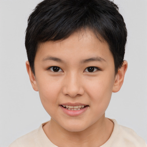 Joyful asian child female with short  brown hair and brown eyes