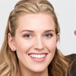 Joyful white young-adult female with long  brown hair and blue eyes