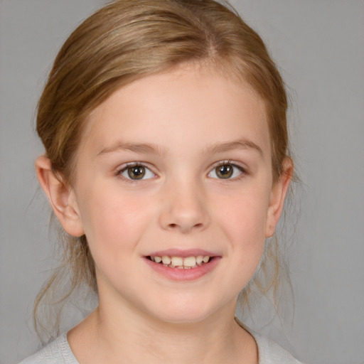 Joyful white child female with medium  brown hair and brown eyes